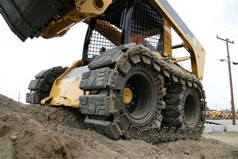 skid steer tires vs tracks|mounted skid steer tires.